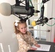 Owner's daughter at the local radio station